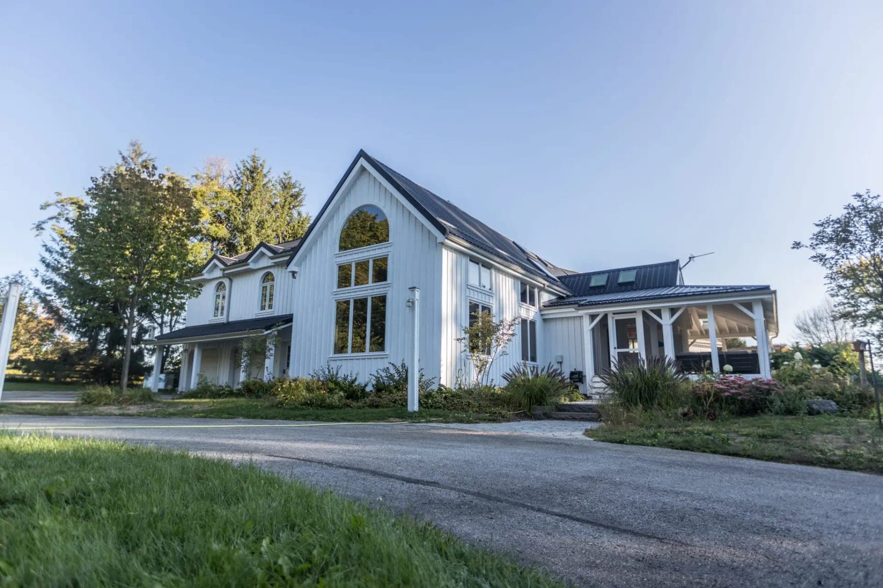 Luxury exterior — white estate home with crisp painted trim