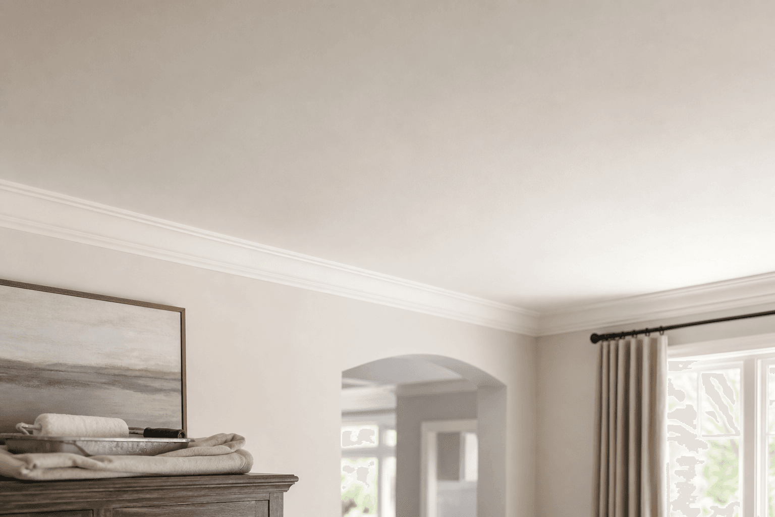 Repaired and repainted ceiling blending into a bright residential room