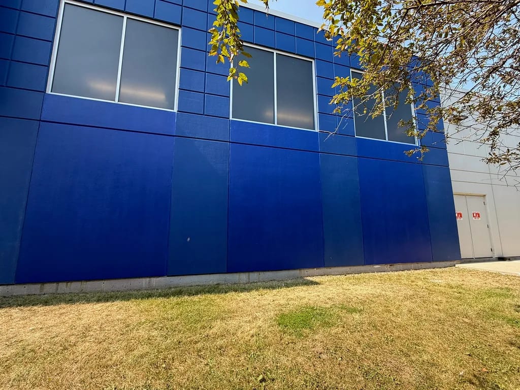 Restored concrete wall panels with blue finish coats at Walmart by Sigma Painting in the Greater Toronto Area