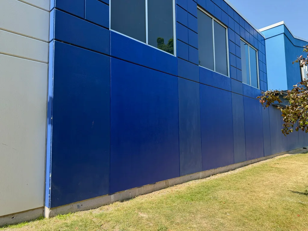 Completed blue concrete facade along a Walmart side elevation by Sigma Painting in the Greater Toronto Area
