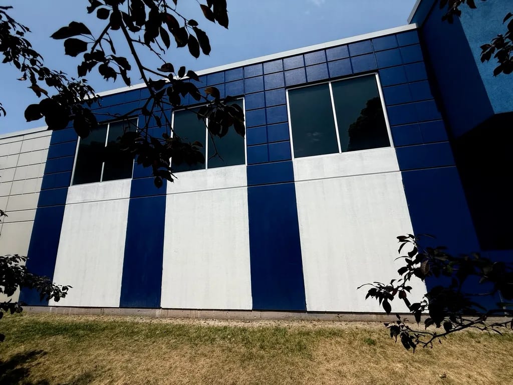 White-primed Walmart concrete wall panels before blue finish coats by Sigma Painting in the Greater Toronto Area