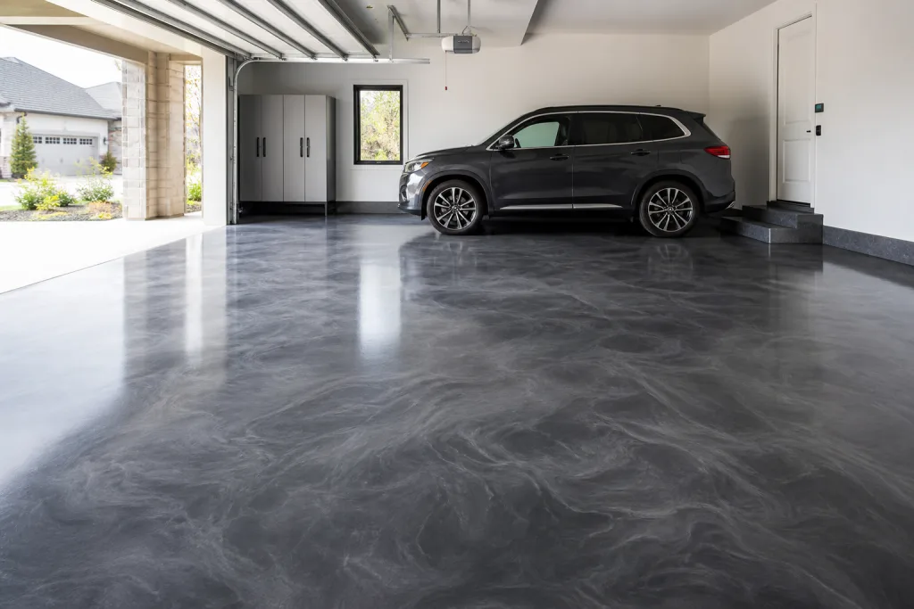 Charcoal metallic epoxy floor coating in a clean residential garage by Sigma Painting