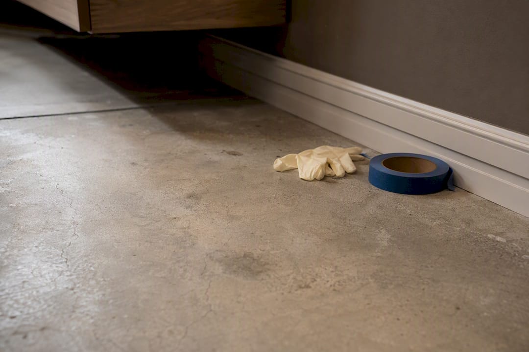 Concrete floor with cracks and stains inspection