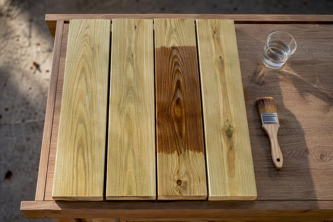 Pine boards with brown stain test area